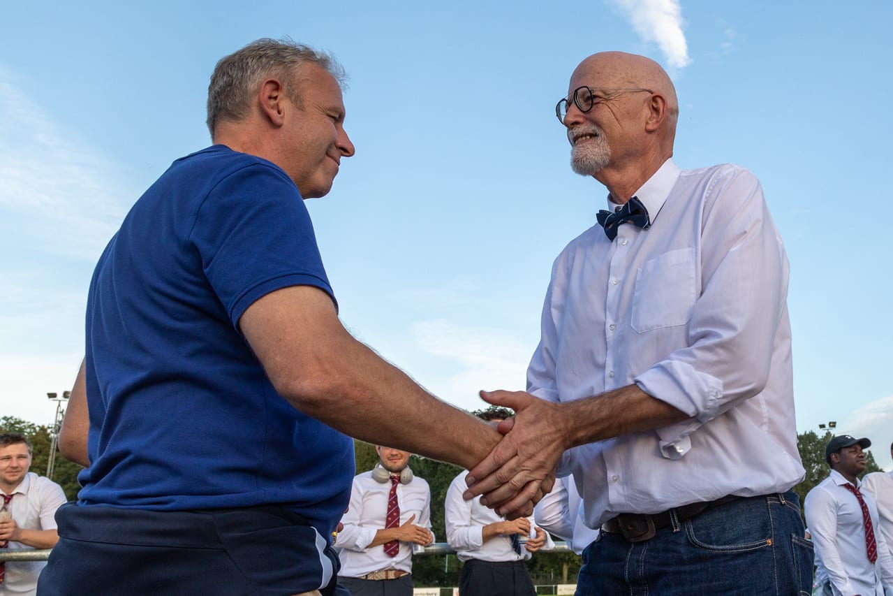 AAC members shaking hands at the club