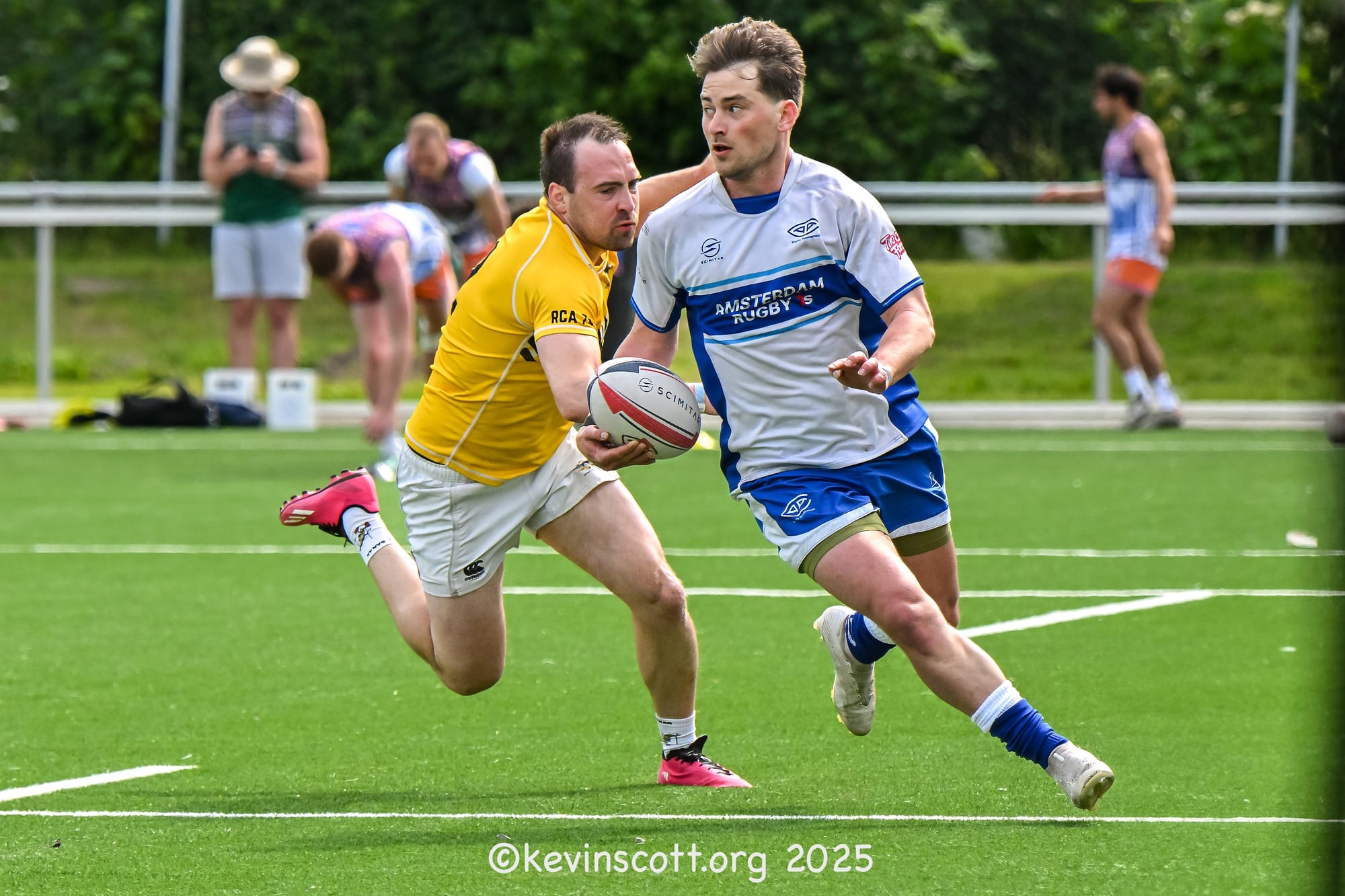 AAC sevens player carries the ball past an Aachen RC tackler